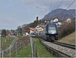 A MOB Ge 4/4 Series 8000, barely visible at the rear of the train, pushes its GoldenPass Express 4065 towards Montreux near Planchamp.