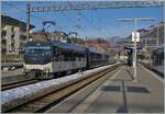 In Montbovon, the Ge 4/4 8002 with its Golden Pass Express GPX is waiting to continue its journey. The GPX is traveling from Montreux to Interlaken Ost. In Zweisimmen, the train will change gauge and a BLS Re 465 will take over the train.

January 20, 2026