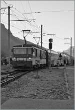 In Black and White: GDe 4/4 with a Golden Pass Panoramic is arriving at Saanen.