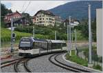 The CEV MVR GTW ABeh 2/6 7505 on the way to the Les Pléides is leaving the  new  St-Légier Gare Station.