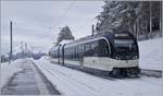 The CEV MVR ABeh 2/6 7505 arrives at the snowy train station of Les Pleiades.