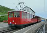 An old Rigi Bahn railcar to Vitznau waits at the Rigi Kulm summit station for its descent into the valley.