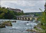 A local train to Winterthur is running over the Rhine Falls bridge in Neuhausen am Rheinfall on September 13th, 2012.