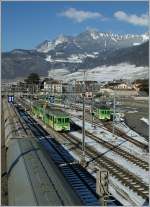 A view of the narrow part of the Aigle Station with a AOMC local train to Monthey.