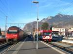 The AOMC local train to Champry waits in Aigle of voyagers from the connection IR service from Lausanne.