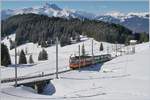 The BVB TPS BDeh 4/4 82 with a local train on the way to the Col de Bretaye by the Col de Soud with Dents de Midi in the Background.