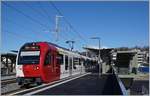 The TPF SURF ABe 2/4 101 on the way to Bulle by his stop in the new Châtel St Denis Station.