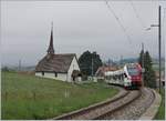 The TPF RABe 527 193 on the way to Fribourg by Vaulruz.