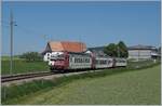 The TPF RBDe 527 182 with a local train on the way to Bulle by Sâles.