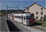 A TPF local Train on the way to Bulle is leaving the Broc Village Station.