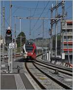 The TPF RABe 527 197 and an other one on the way to Broc Fabrique are arriving at Bulle.