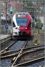 The TPF RABe 527 196 departs Neuchâtel as S21 towards Fribourg. The photo was taken from the platform with plenty of zoom.

August 24, 2026