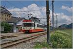 The TransN BDe 4/4 N° 8 is on the way from Les Ponts de Martel to La Chaux de Fonds and makes a stop in La Sagne .
