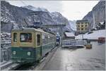 The WAB BDeh 4/4 115 in Lauterbrunnen and in the background the Staubbach Waterfall.