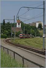 A WB (Waldenburger Bahn) local train by Oberdorf Winkelweg.
In the background the St Peter Church. 
 22.06.2017
