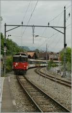 The  zb  (Zentralbahn) De 110 001-3 with his GoldenPass-Service is arriving at Brienz. 
01.06.2012