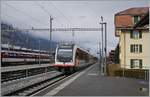 The Zentralbahn 150 104-4 is on the way form Luzern to Interlaken and is arriving at the Meiringen Station.