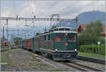 At first glance, the same picture appears, but here the SBB HGe I 4/4 1992 Giswil is shunting its special train into the siding, and so the waving passengers are  missing. 

The locomotive, with the typical SBB face similar to an Ae 6/6 or Re 4/4 II, was acquired in 1954 with the HGe 4/4 1991 to relieve the Dhe 4/4 on the Brünig Railway's mountain route. The locomotive is so powerful that, on the one hand, it was given the name  Muni,  but, on the other, the locomotive's transmission wasn't quite up to the high horsepower.  Muni  means something like  bulky bull. 

August 23, 2025