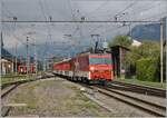 The Zentralbahn HGe 101 966-0 is on its way to Interlaken Ost with a reinforcement train and is just leaving Meiringen.