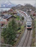 At Ringgenberg on the magnificent viaduct right in the middle of the town, a Zentralbahn IR is on its way from Interlaken Ost to Lucerne.