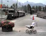 Ge 6/6 I No 411 and a very young enthusiast, Bergn in August 1990.