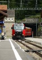 The RhB Ge 4/4 III 648 is coming out of the Albula Tunnel and arriving with his RE to Chur in Preda.
19.09.2009
