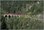 A RhB Ge 4/4 III wiht a  Albula  fast train Service near Filisur on the way to St Moritz.