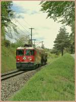 The RhB Ge 4/4 II 632 with a Cargo Train by Reichenau Tamins.