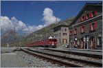 A RhB Bernina local train is arriving at Bernina Ospizio.