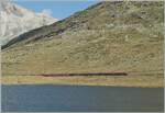 A RhB Bernina Railway ABe 8/12 'Allegra' is shortly before Ospizio Bernina with a rather long train on its way towards Tirano.  
September 10, 2011