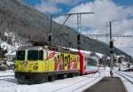 RhB Ge 4/4 II 611 with his Glacier Express is arriving at Disentis.