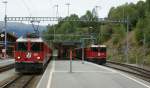 RhB Ge 4/4 II 618 in Flisur with RE to St.Moritz and Ge 4/4 II 628 with local train to Davos.