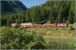 RhB Ge 4/4 II 631 with a local train from Pontresina to Scuol Tarasp by Susch.