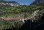 A RhB Ge 4/4 III 649  20 Minuten  with his Albula Fast-Serice from Chur to St Moritz by Filisur on the Landwasser Viaduct.