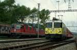 SBB Re 4/4 II and RhB Ge 474 II 611 in Felsberg.