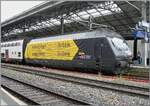 The SBB Re 460 028 (Re 460 91 85 4 460 028-4 CH-SBB) sports the attractive advertising decoration  Swiss Hiking Trails,  here once again but with the focus on the side panel, which is designed like a signpost.  
The locomotive is traveling with IR 90 1819 from Genève Aéroport to Brig and was photographed again in Lausanne.

June 4, 2026
