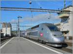 A TGV Lyria from Paris is arriving at  Lausanne.