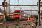 A Zurich S-Bahn train arrives at Ruemlang