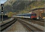 A  Dispo  train consisting of EW I and EW II pushed by an SBB Re 4/4 II arrives at Brig station.