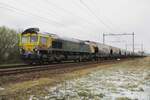 No joke! Snow on 1 April 2022 and Freightliner 653-02 passes the photographer hauling a cereals train toward nearby Oss through Alverna.