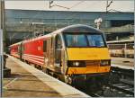 Virgin Class 90 002 in London Euston waits on the departure.