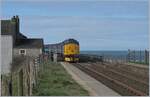 Pushing the Carlisle (8:42) service to Barrow (11:30), Northern's hired Class 37, 37 403, leaves the Parton halt.