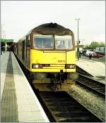 The 60 012 has to waiting with his cargo train in the Cardiff Central Station.