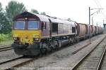 66020 still in it's EWS colours, passing Ely northbound with an aggregates train.