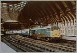 A British Rail (BR) Class 31 diesel locomotive with his train by the stop in York. 
20.06.1984