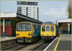 143 604 and 121 032 in The Cardiff Queen Street Station. 
28.04.2010