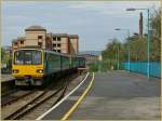 The 143 604 is arriving in the Cardiff Queen Street Station.