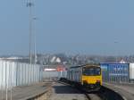 Northern 150 148 is leaving Heysham Port.