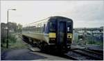 The 153 Class 153374 is leaving the Tenby / Dinbych-y-pysgod Station. 

analog picture 09.11.2000