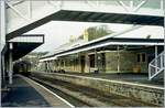 A Class 153 is leaving the Tenby / Dinbych-y-pysgod Station.